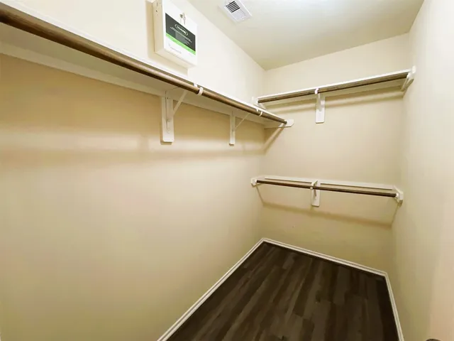 a view of an empty walk in closet