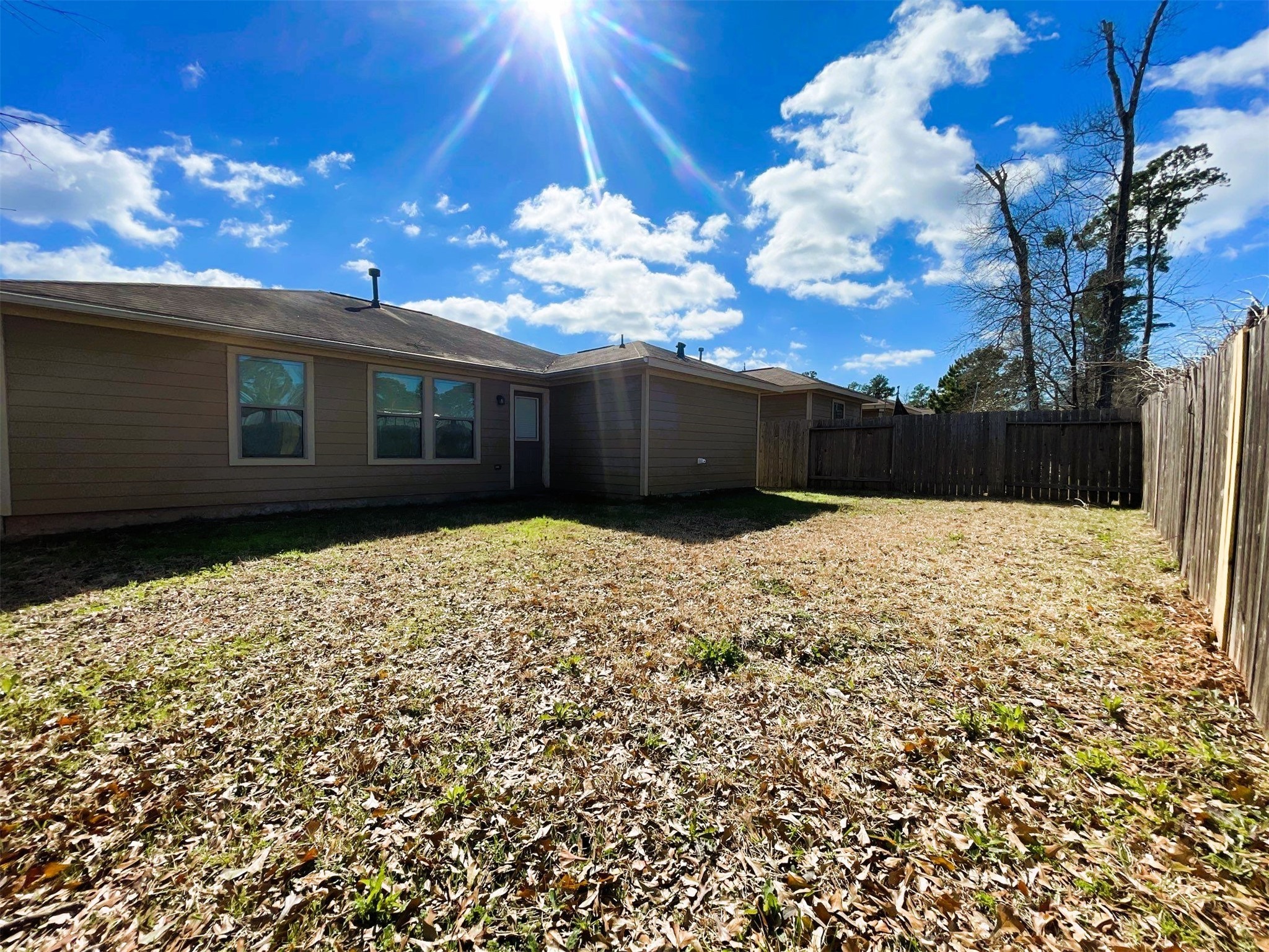 819 Katydid Court Conroe, TX 77301 - Photo 24 of 26 a view of a house with a yard