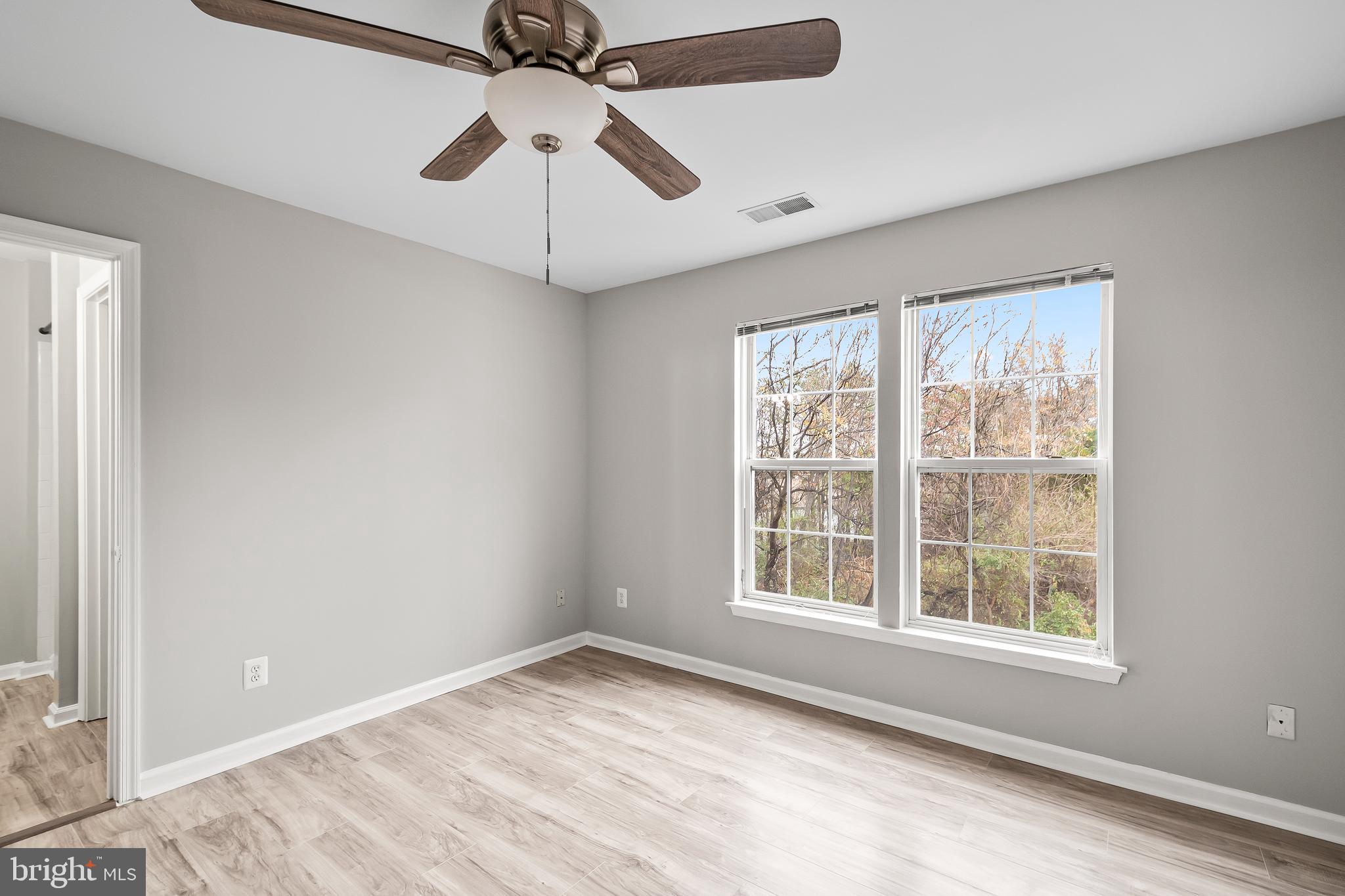 10305 Butternut Circle Manassas, VA 20110 - Photo 13 of 30 a view of an empty room with a window