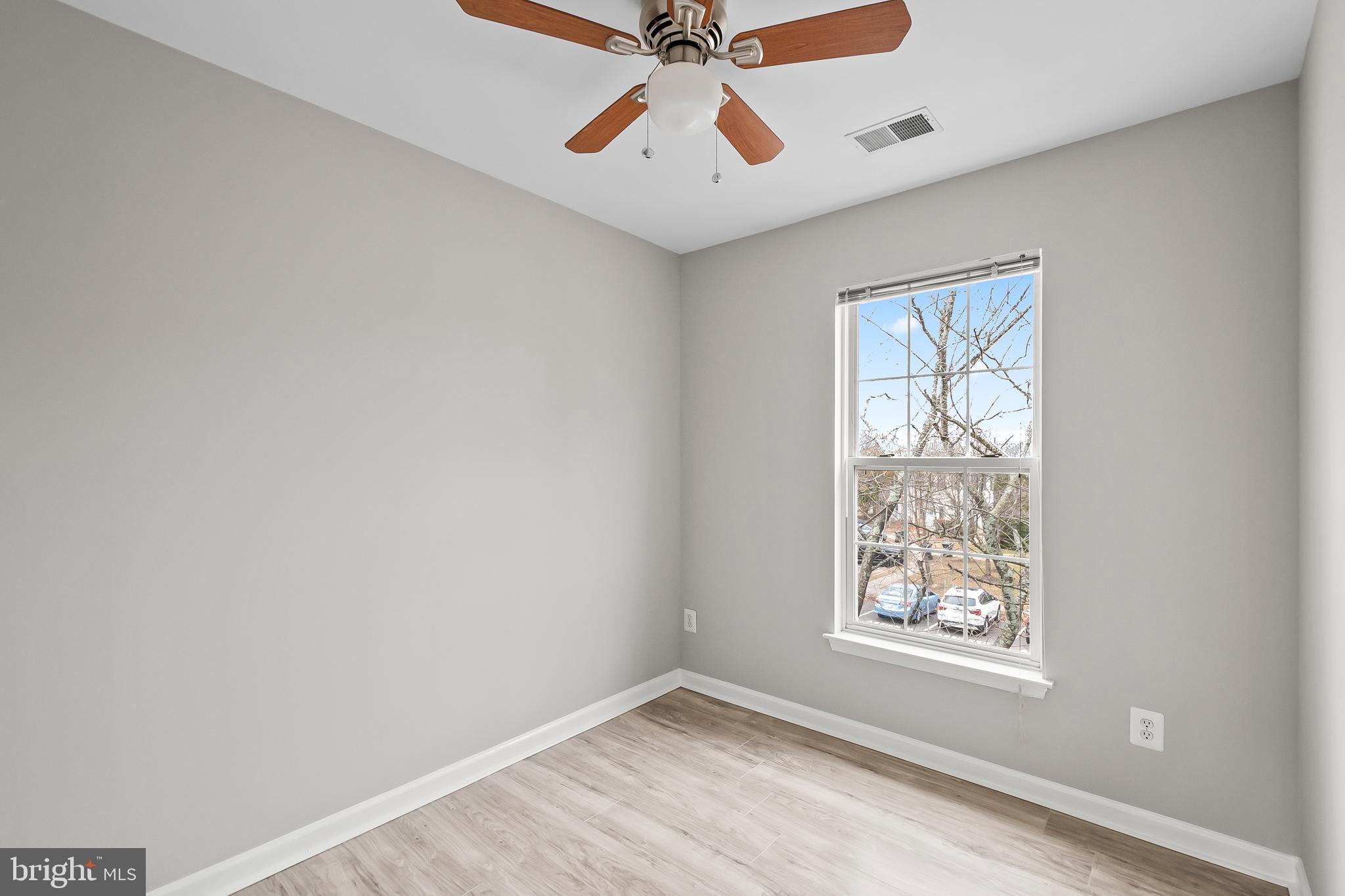 10305 Butternut Circle Manassas, VA 20110 - Photo 18 of 30 an empty room with windows and fan