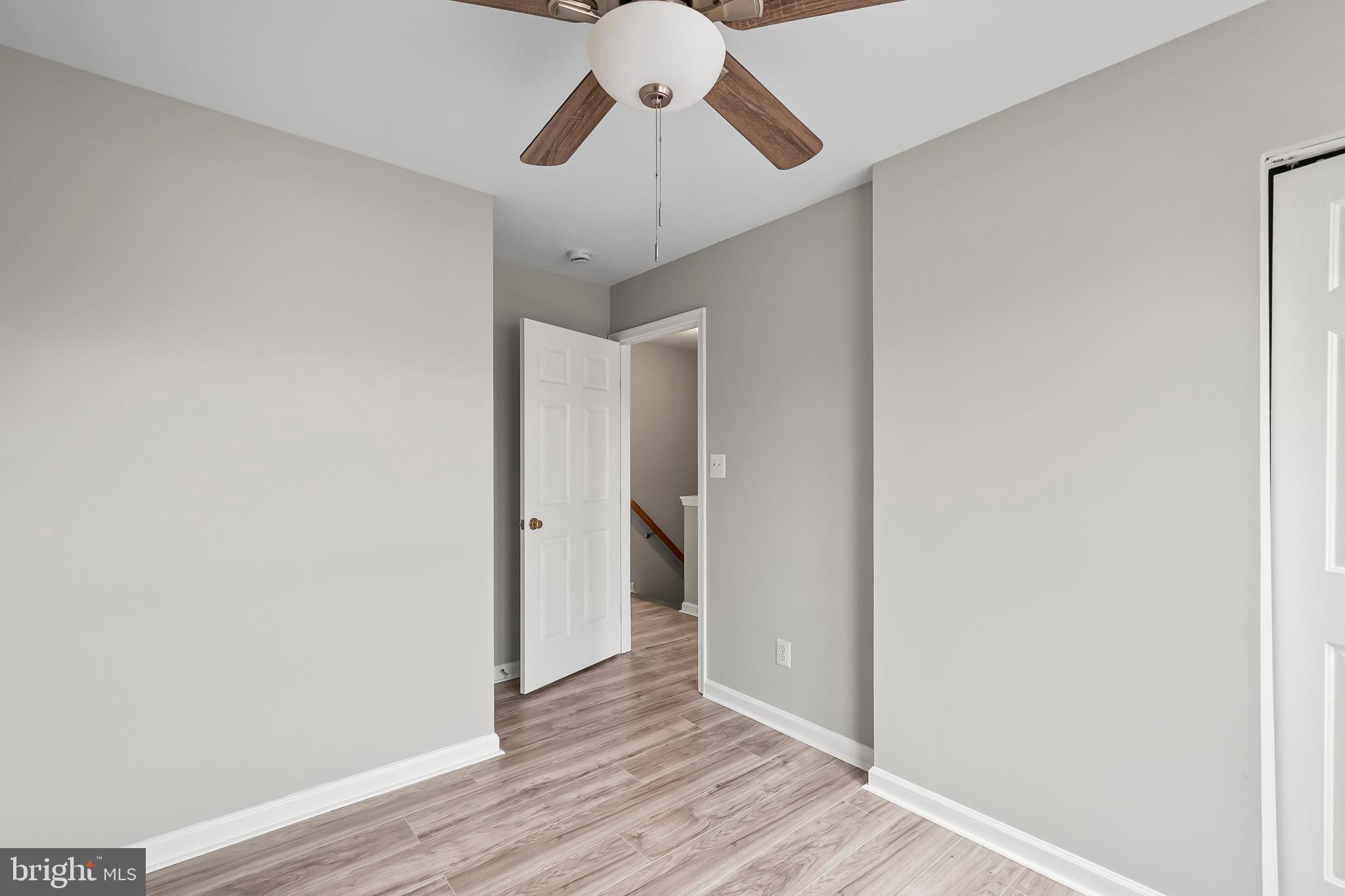 10305 Butternut Circle Manassas, VA 20110 - Photo 19 of 30 a view of empty room with wooden floor