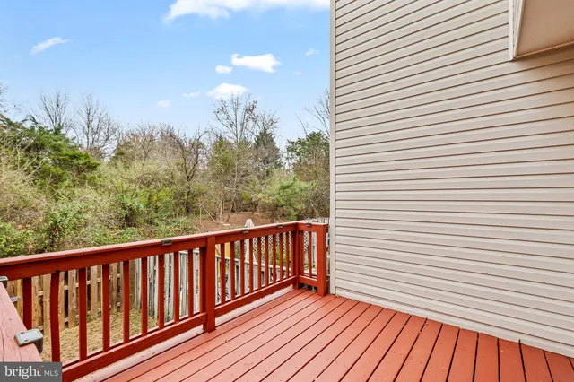 a view of a balcony with wooden floor