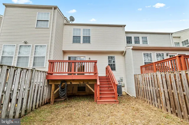 a view of a house with wooden deck