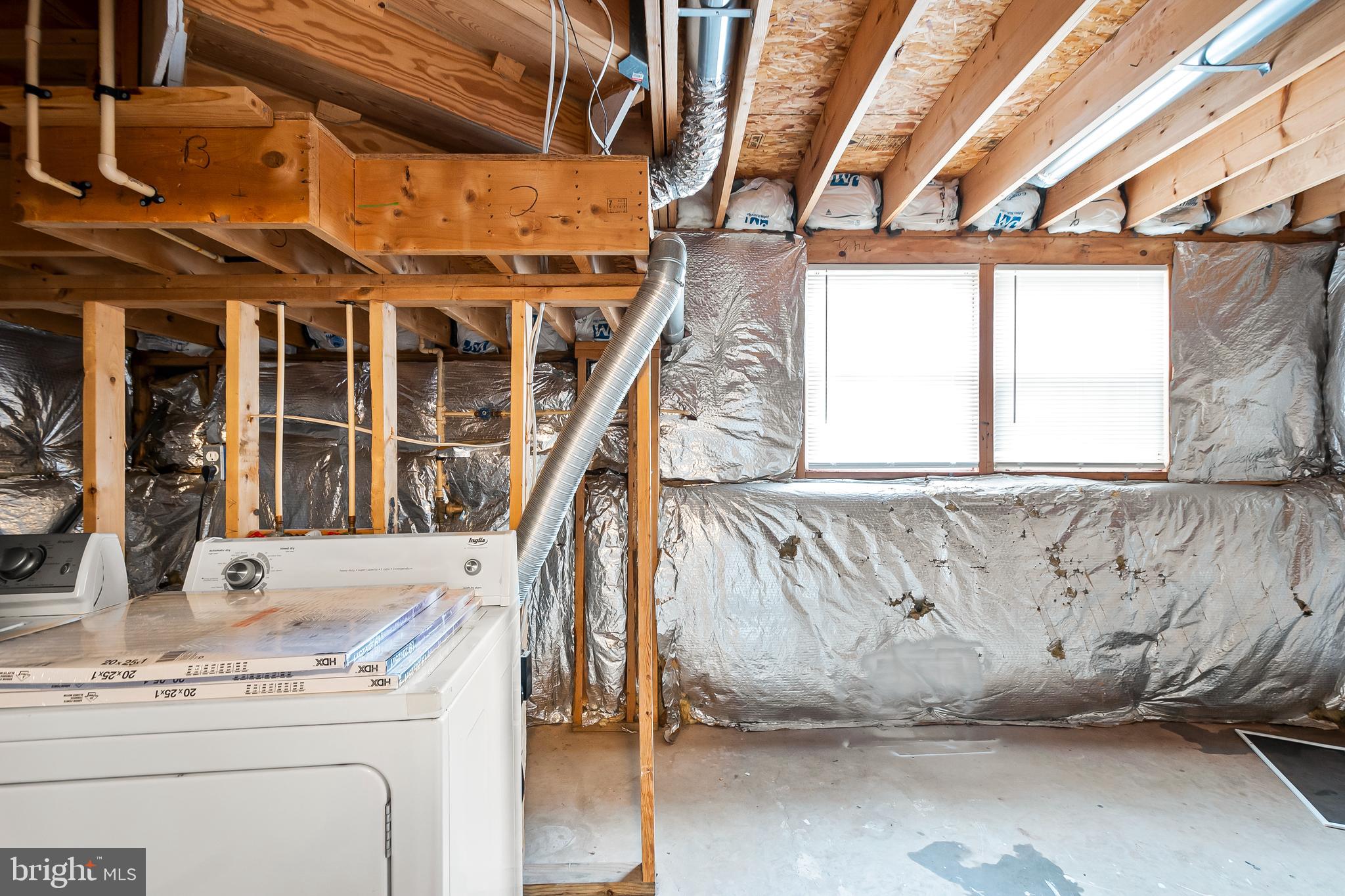 10305 Butternut Circle Manassas, VA 20110 - Photo 25 of 30 a view of walk in closet with window and stairs