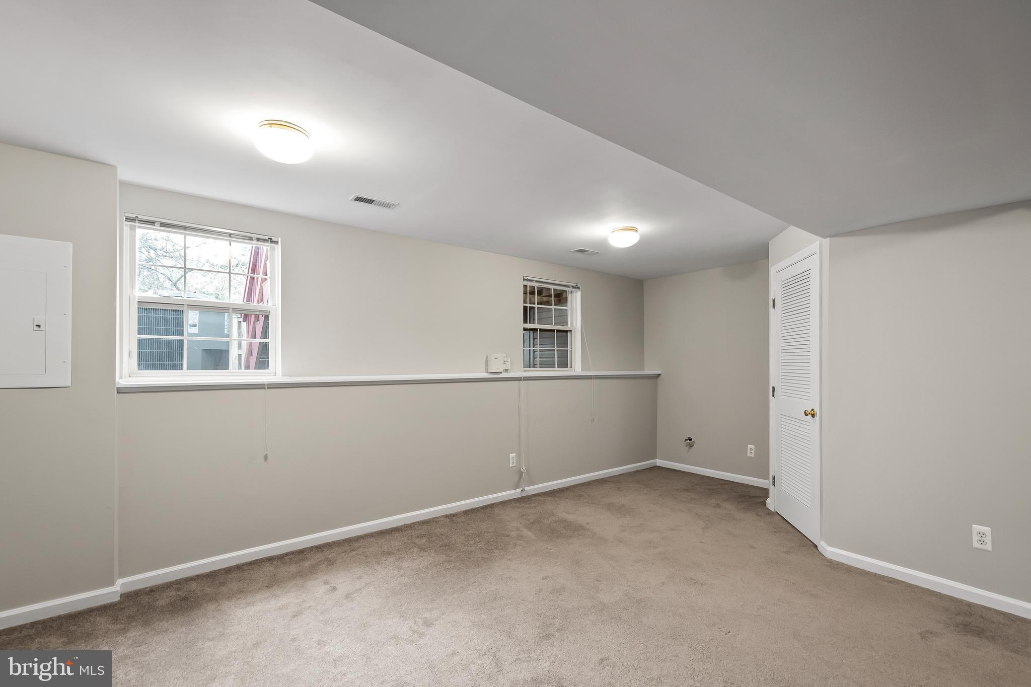 10305 Butternut Circle Manassas, VA 20110 - Photo 27 of 30 an empty room with windows