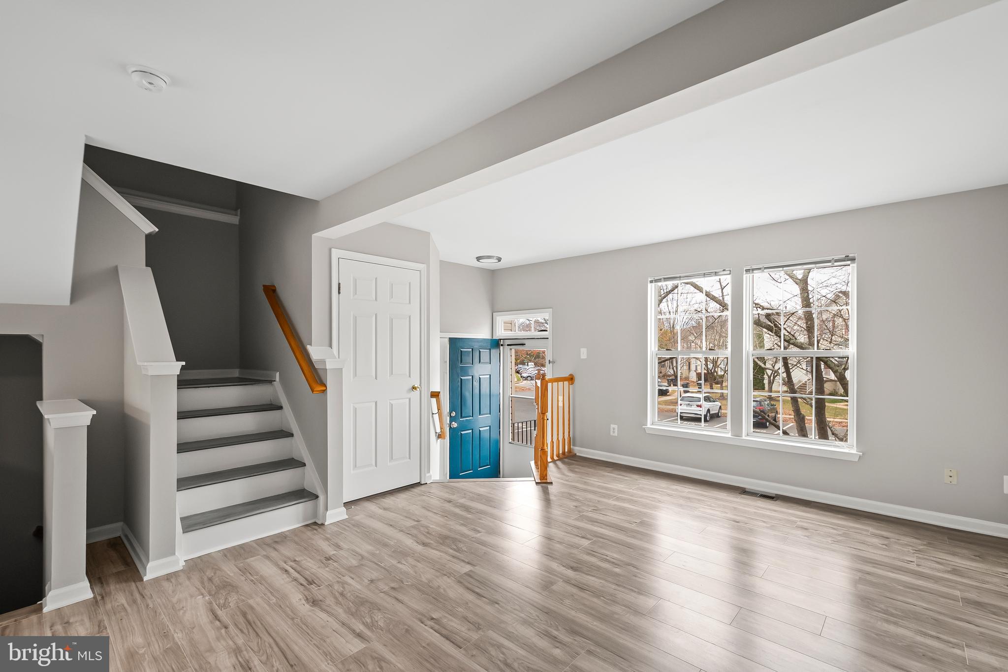 10305 Butternut Circle Manassas, VA 20110 - Photo 4 of 30 a view of an empty room with a window and wooden floor