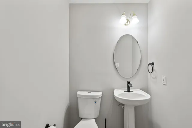 a bathroom with a toilet and a sink