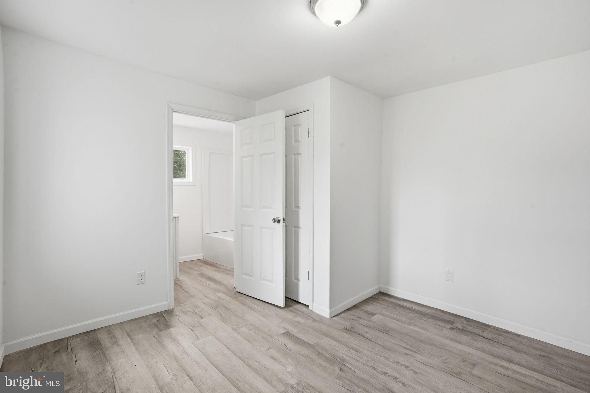 603 Academy Street Cambridge, MD 21613 - Photo 16 of 22 a view of an empty room with wooden floor