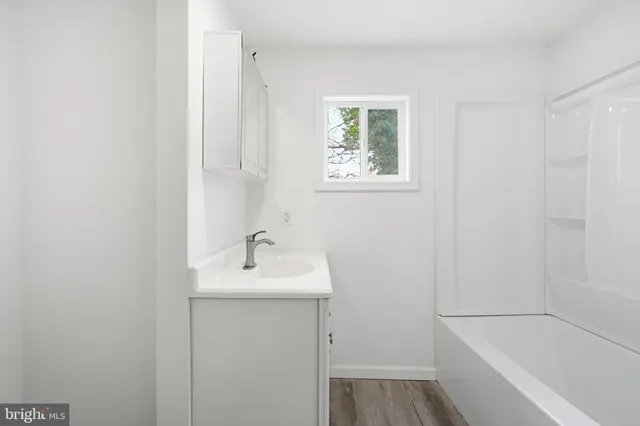 a bathroom with a sink and a bathtub