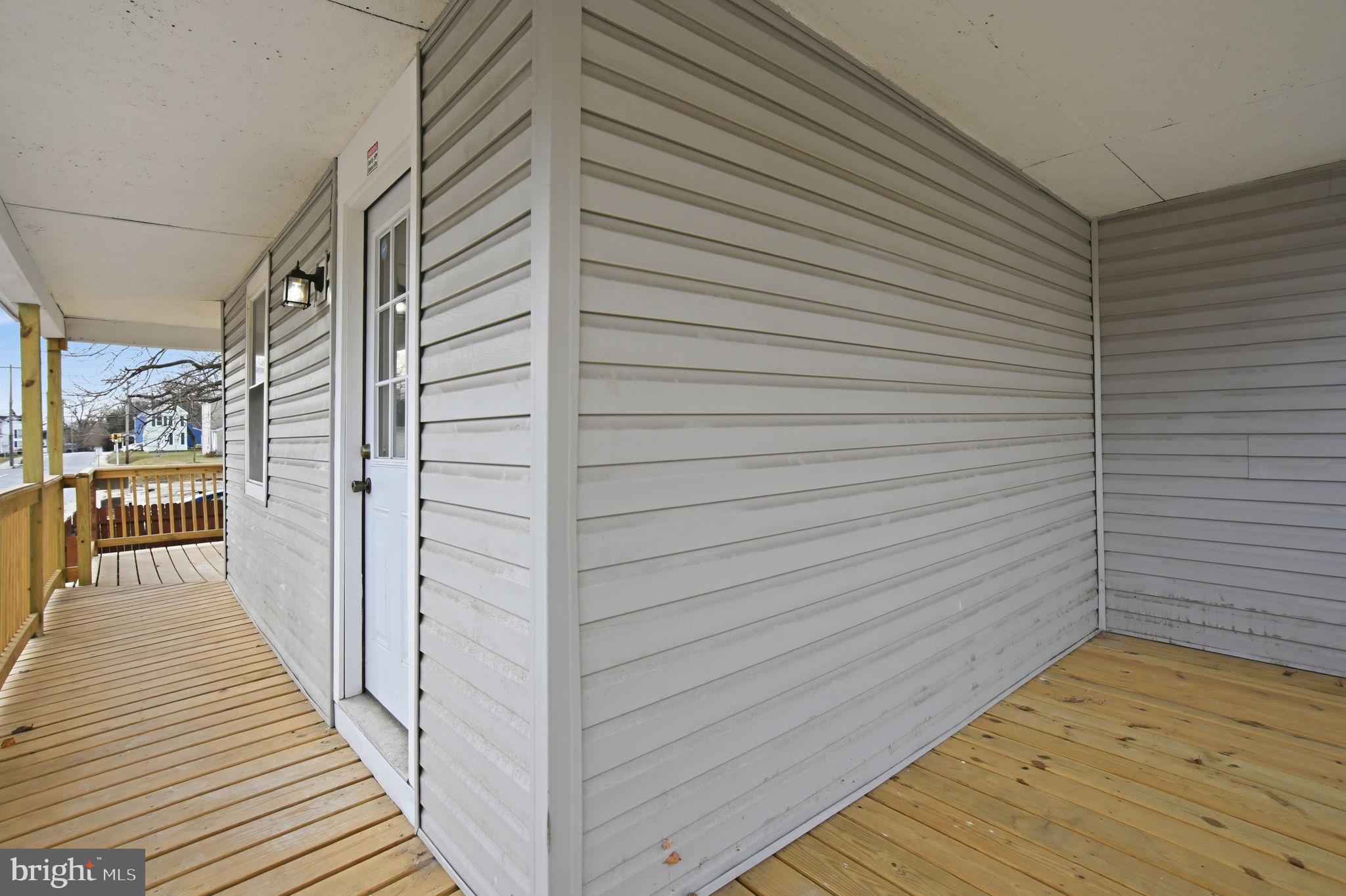 603 Academy Street Cambridge, MD 21613 - Photo 21 of 22 a view of a balcony with wooden floor