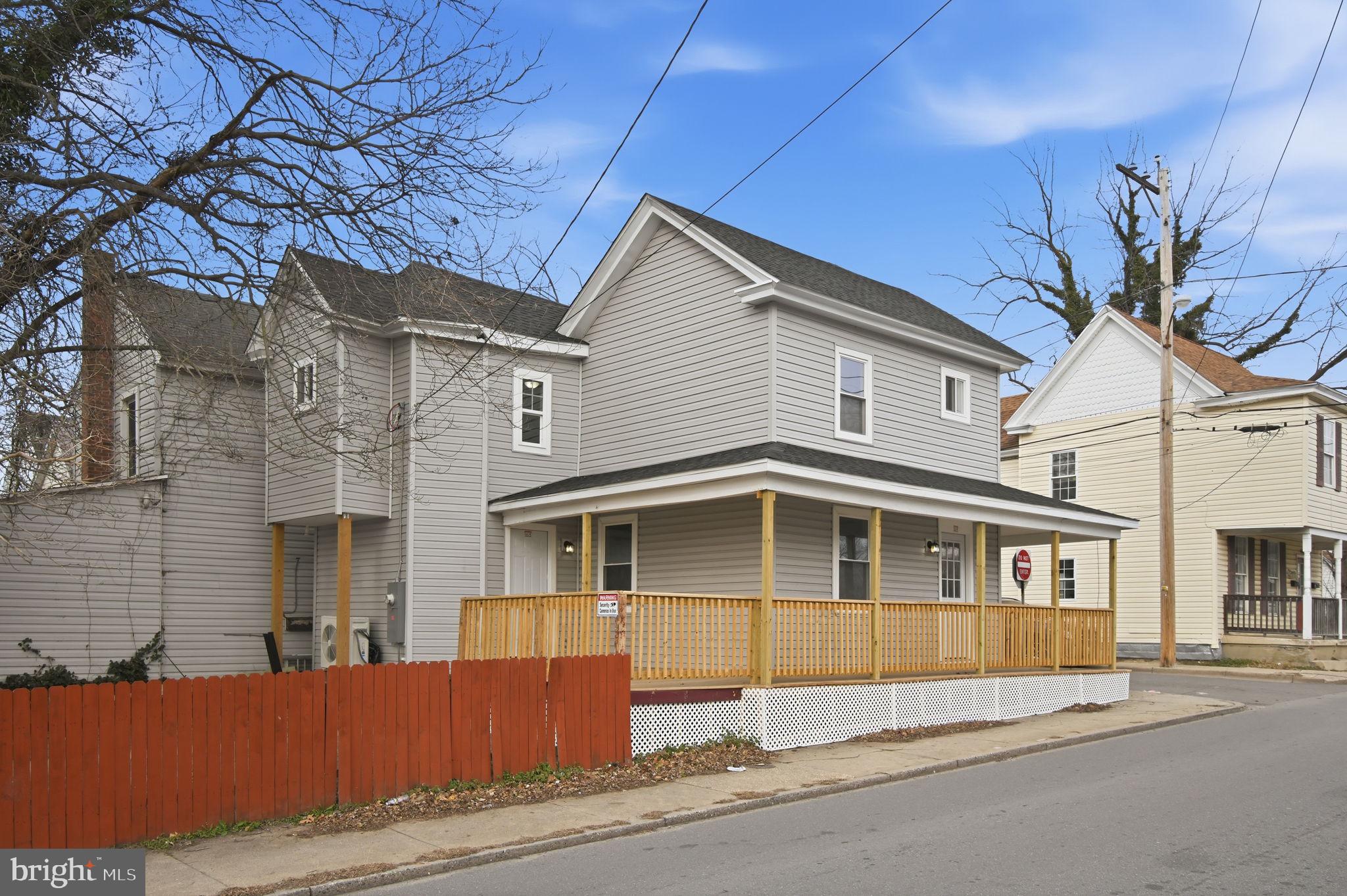 603 Academy Street Cambridge, MD 21613 - Photo 3 of 22 a front view of a house with a yard