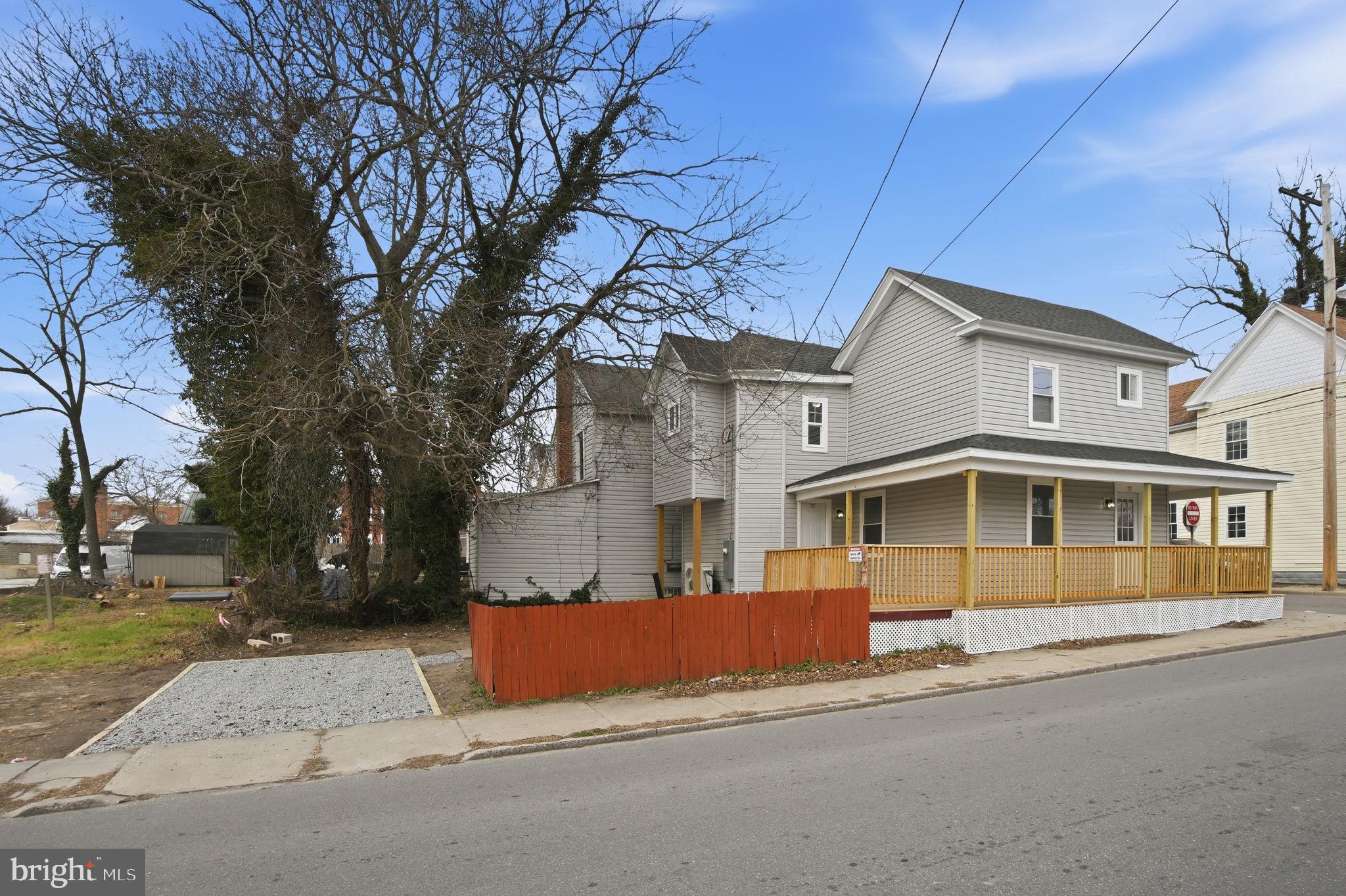 603 Academy Street Cambridge, MD 21613 - Photo 4 of 22 a front view of a house with a yard