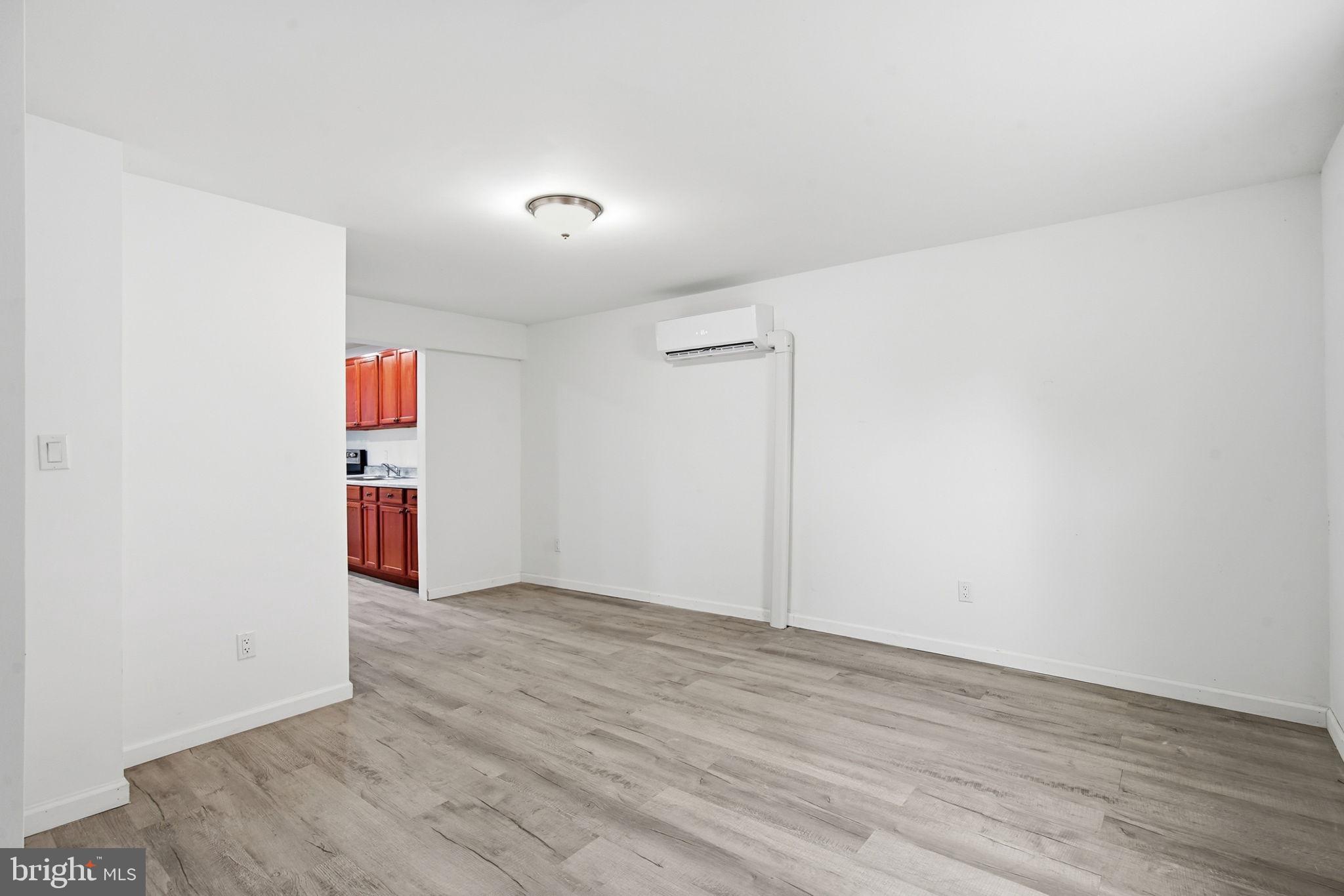 603 Academy Street Cambridge, MD 21613 - Photo 9 of 22 a view of empty room with wooden floor