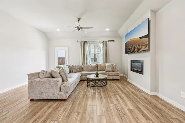a bedroom with a bed lamp and a chandelier