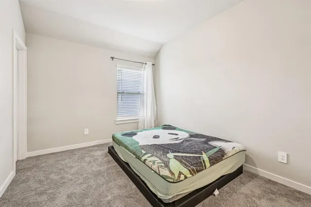 a view of room with window and bathroom