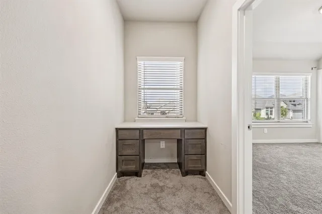 a room with a bed and a night stand