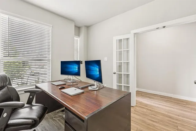 a view of a workspace with furniture
