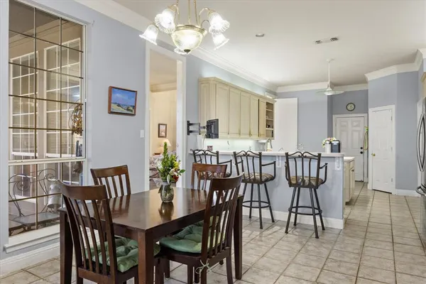 a view of a a dining room with furniture window and outside view