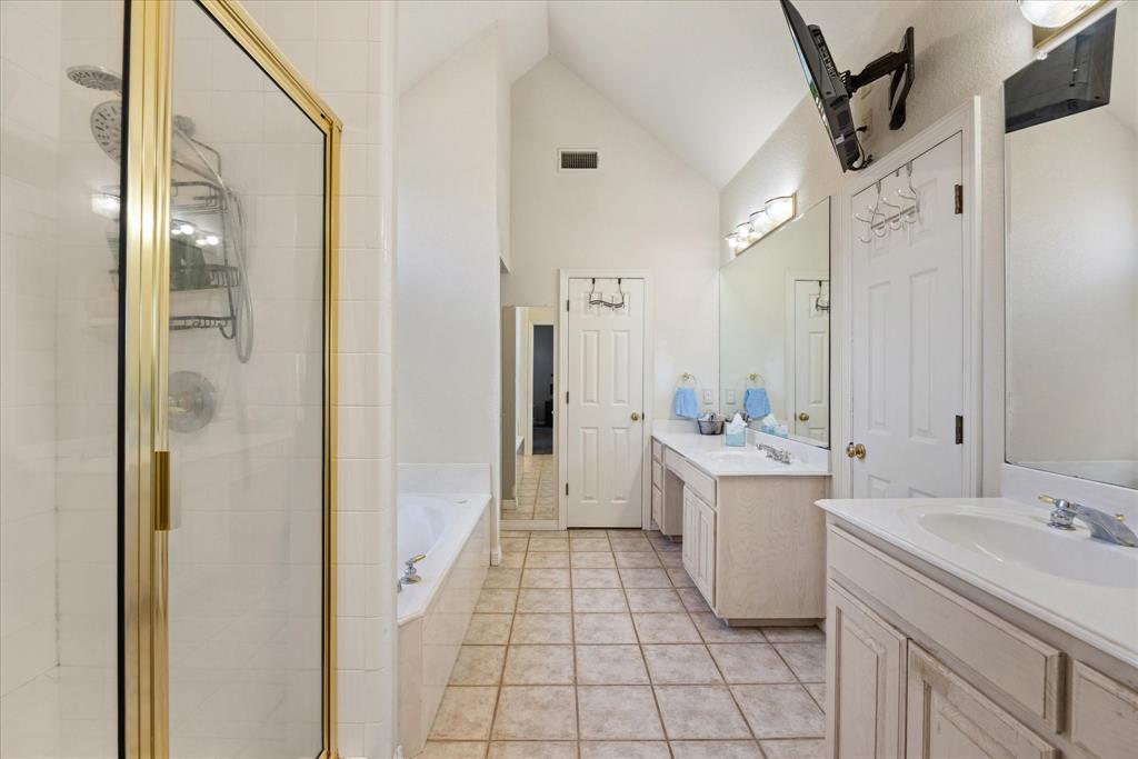1636 Greenview Court Aledo, TX 76008 - Photo 16 of 30 a bathroom with a sink a toilet and shower