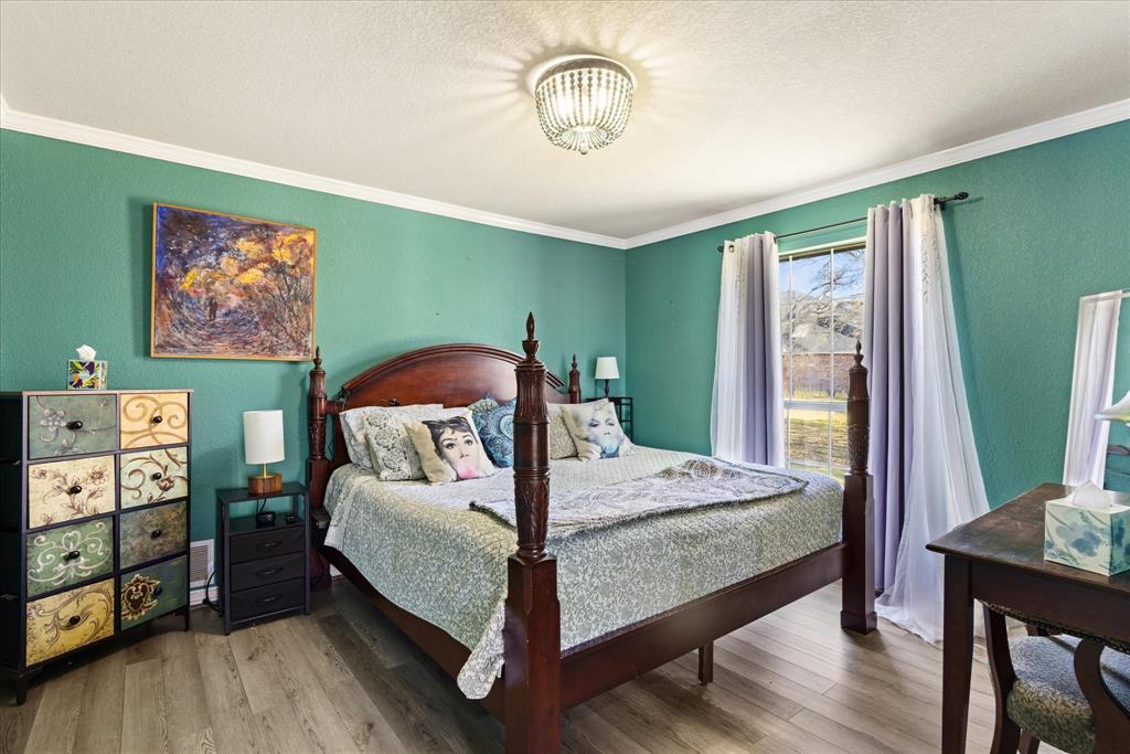 1636 Greenview Court Aledo, TX 76008 - Photo 21 of 30 a bedroom with a bed and a window