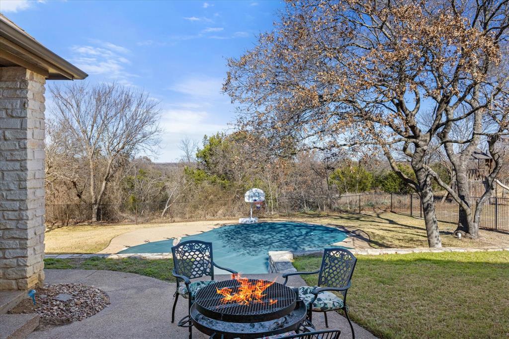 1636 Greenview Court Aledo, TX 76008 - Photo 24 of 30 a backyard of a house with table and chairs