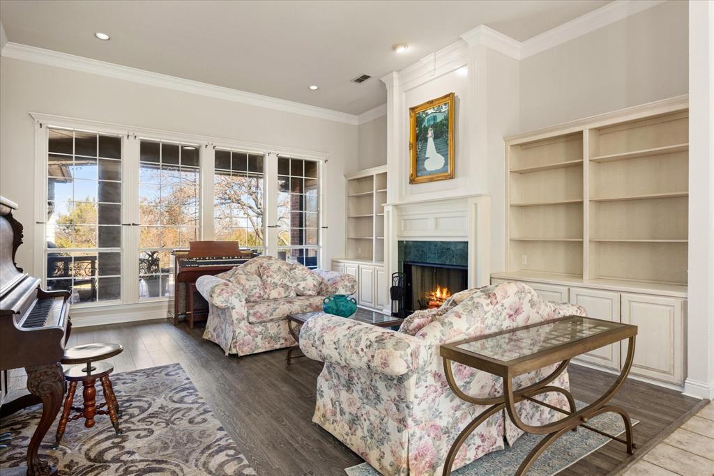 1636 Greenview Court Aledo, TX 76008 - Photo 3 of 30 a living room with furniture wooden floor and a fireplace