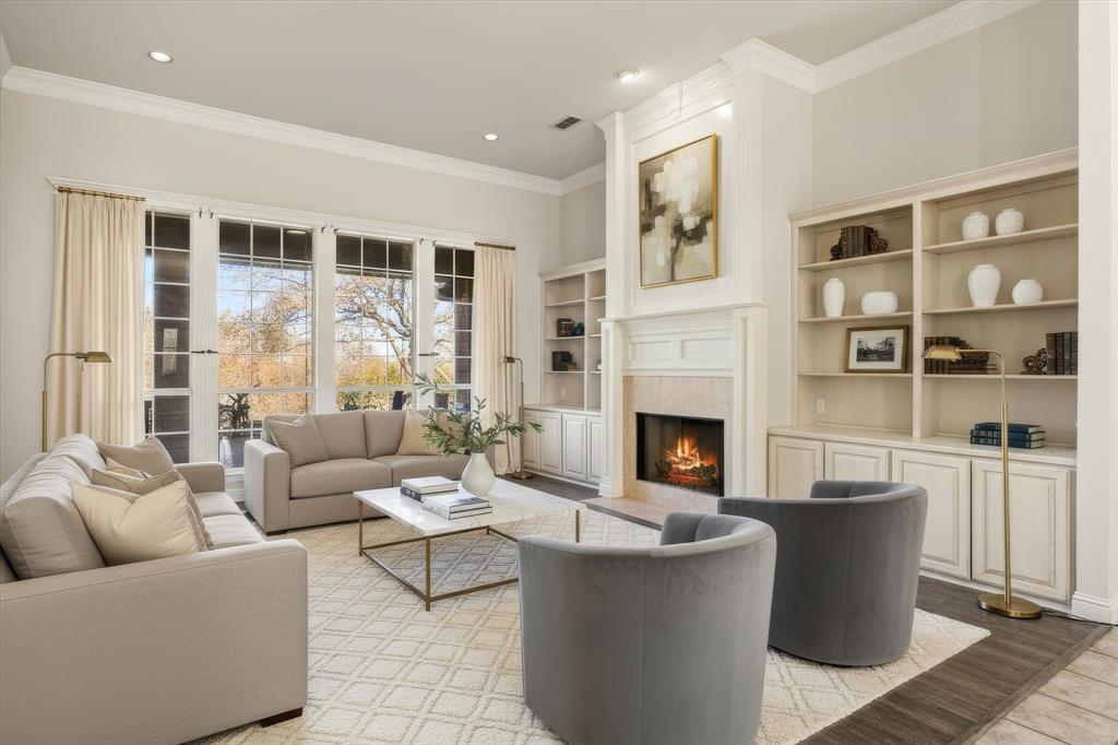 1636 Greenview Court Aledo, TX 76008 - Photo 4 of 30 a living room with furniture a fireplace and a large window