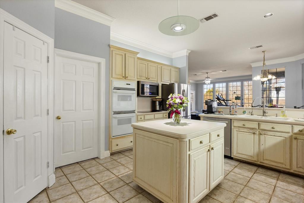 1636 Greenview Court Aledo, TX 76008 - Photo 6 of 30 a kitchen with sink cabinets and refrigerator