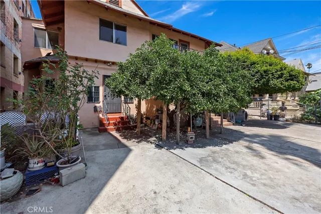 a view of a backyard with sitting area