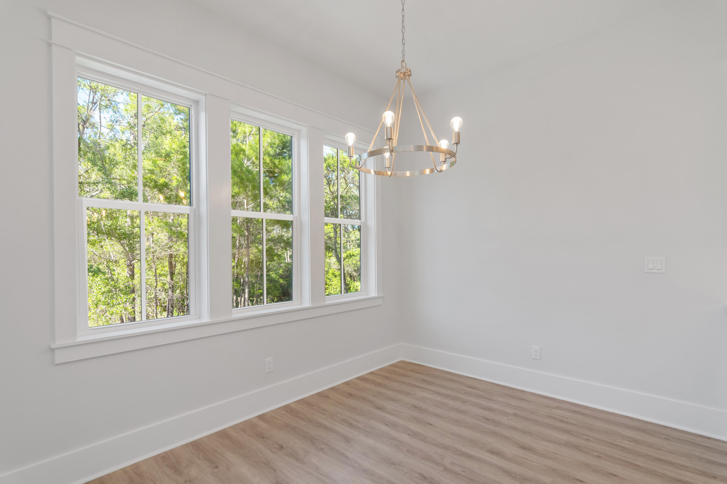 15 Lake Mist Ln Inlet Beach Inlet Beach, FL 32461 - Photo 11 of 48 a view of empty room with wooden floor and fan