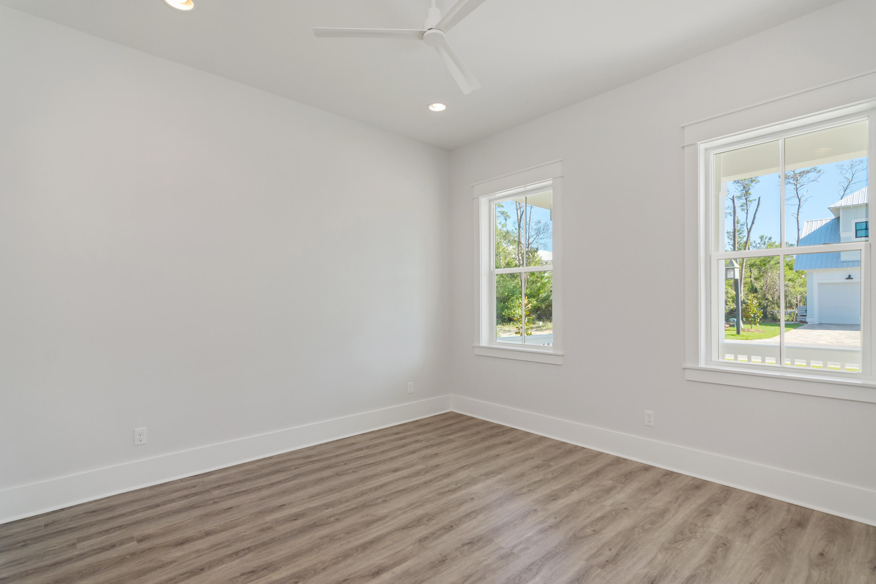 15 Lake Mist Ln Inlet Beach Inlet Beach, FL 32461 - Photo 13 of 48 an empty room with wooden floor and windows