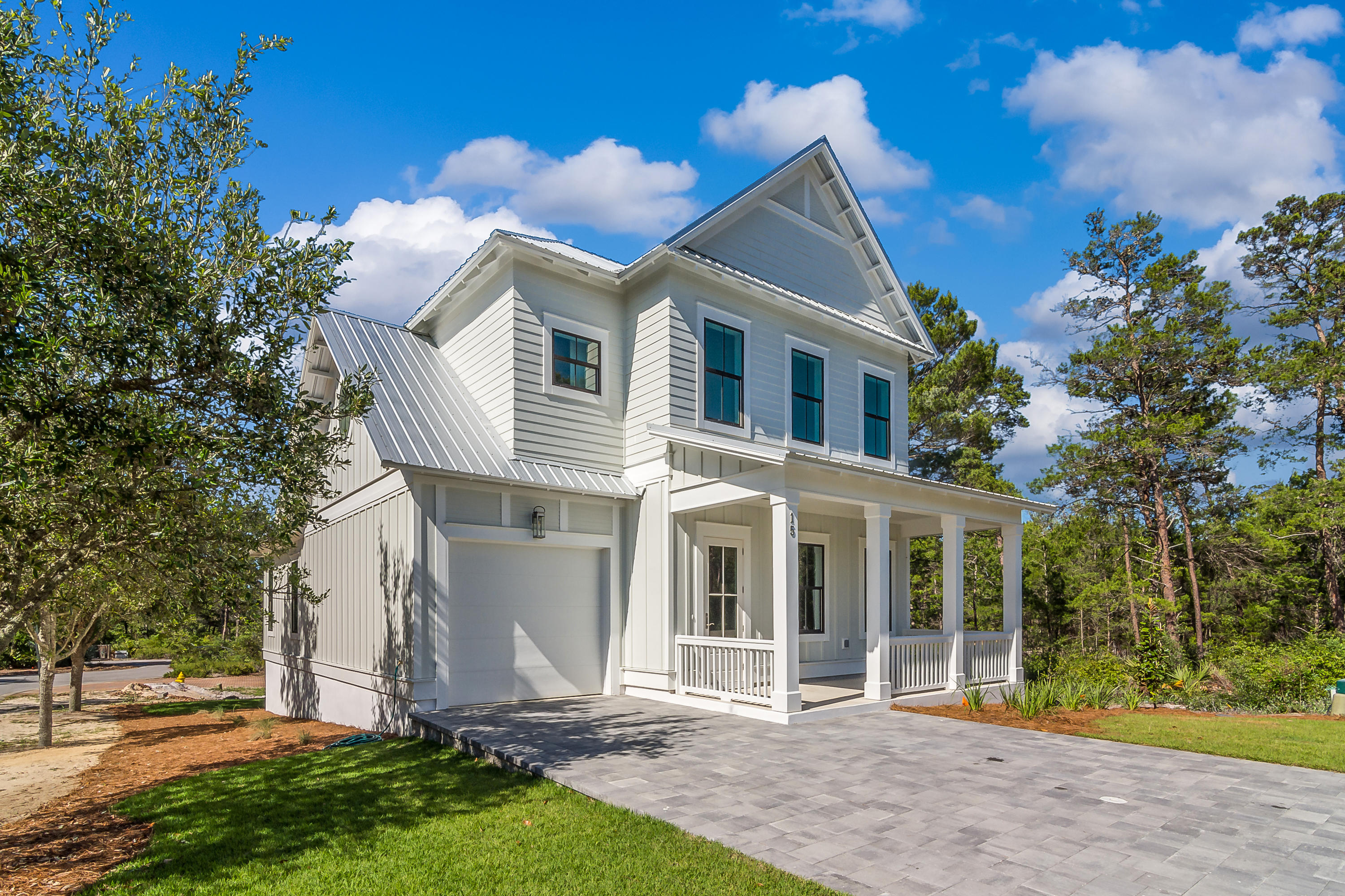 15 Lake Mist Ln Inlet Beach Inlet Beach, FL 32461 - Photo 2 of 48 a front view of a house with garden