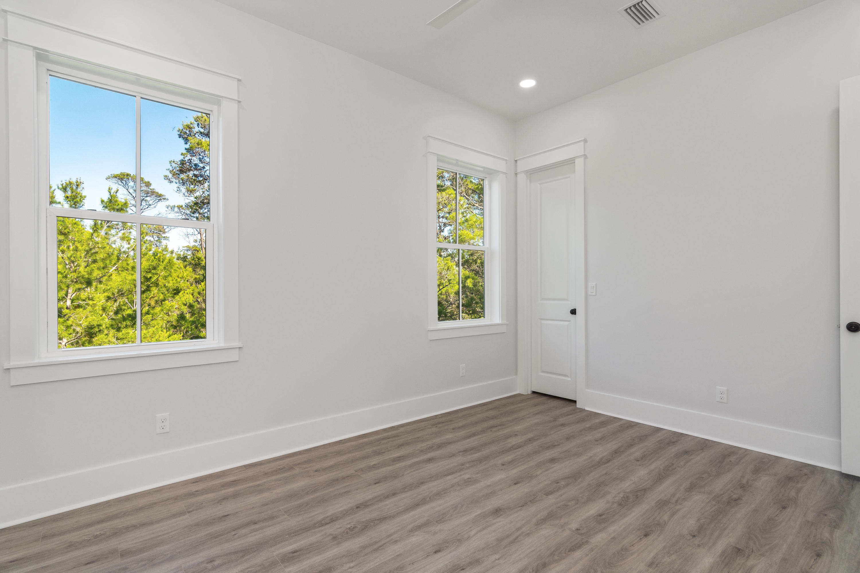 15 Lake Mist Ln Inlet Beach Inlet Beach, FL 32461 - Photo 34 of 48 wooden floor in an empty room with a window