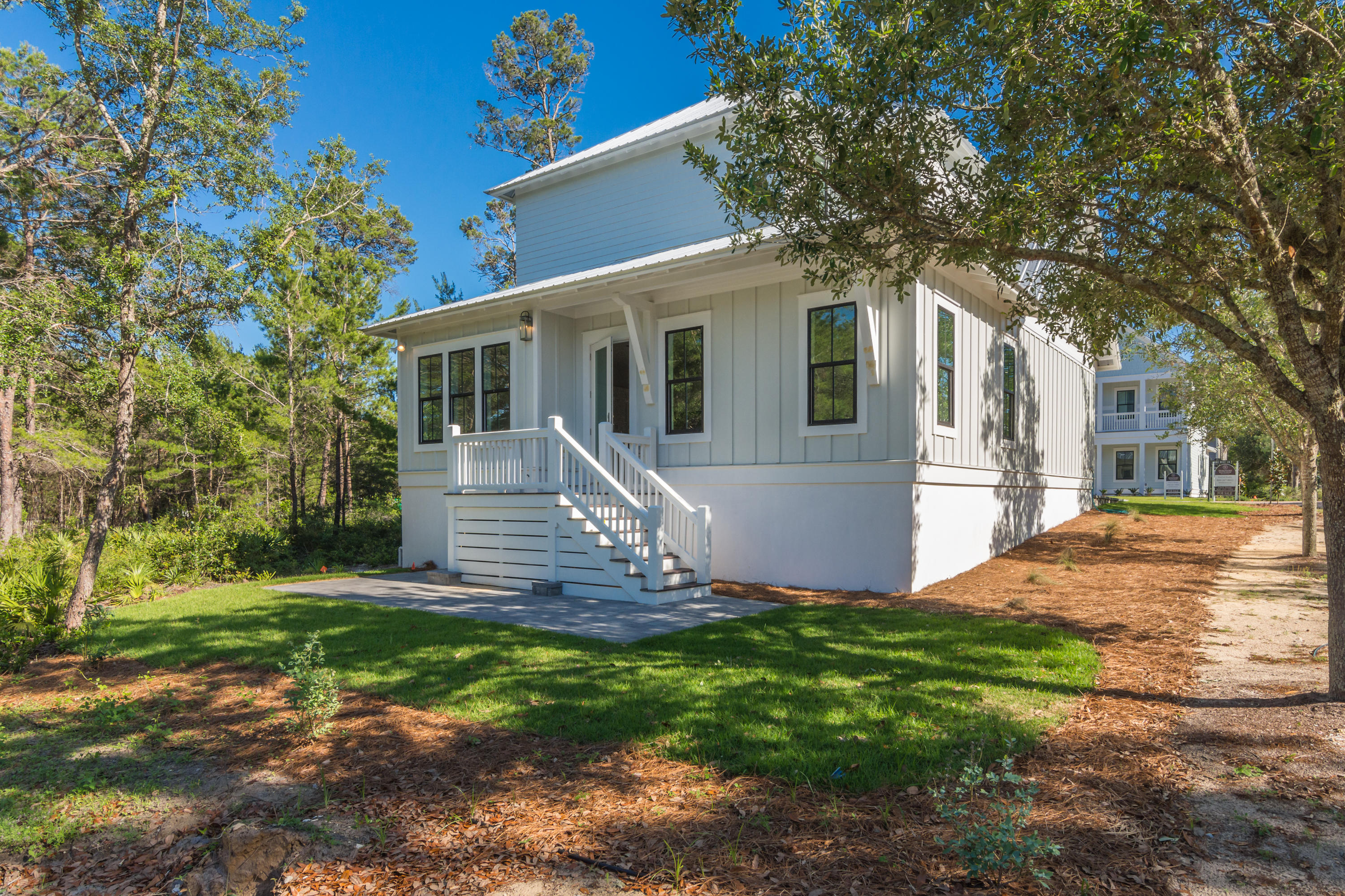 15 Lake Mist Ln Inlet Beach Inlet Beach, FL 32461 - Photo 40 of 48 a front view of house with yard and green space