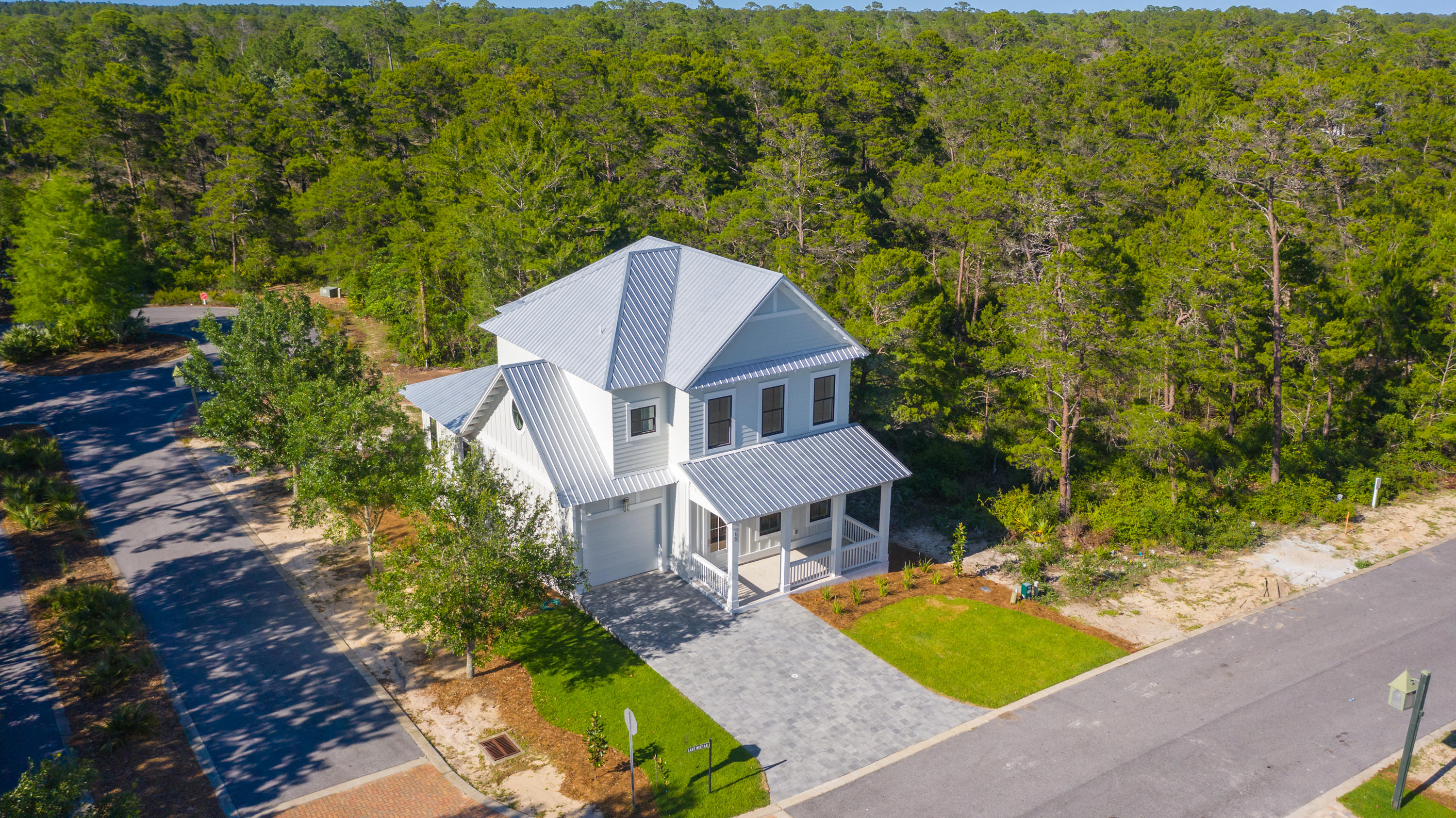 15 Lake Mist Ln Inlet Beach Inlet Beach, FL 32461 - Photo 42 of 48 an aerial view of a house with swimming pool and garden