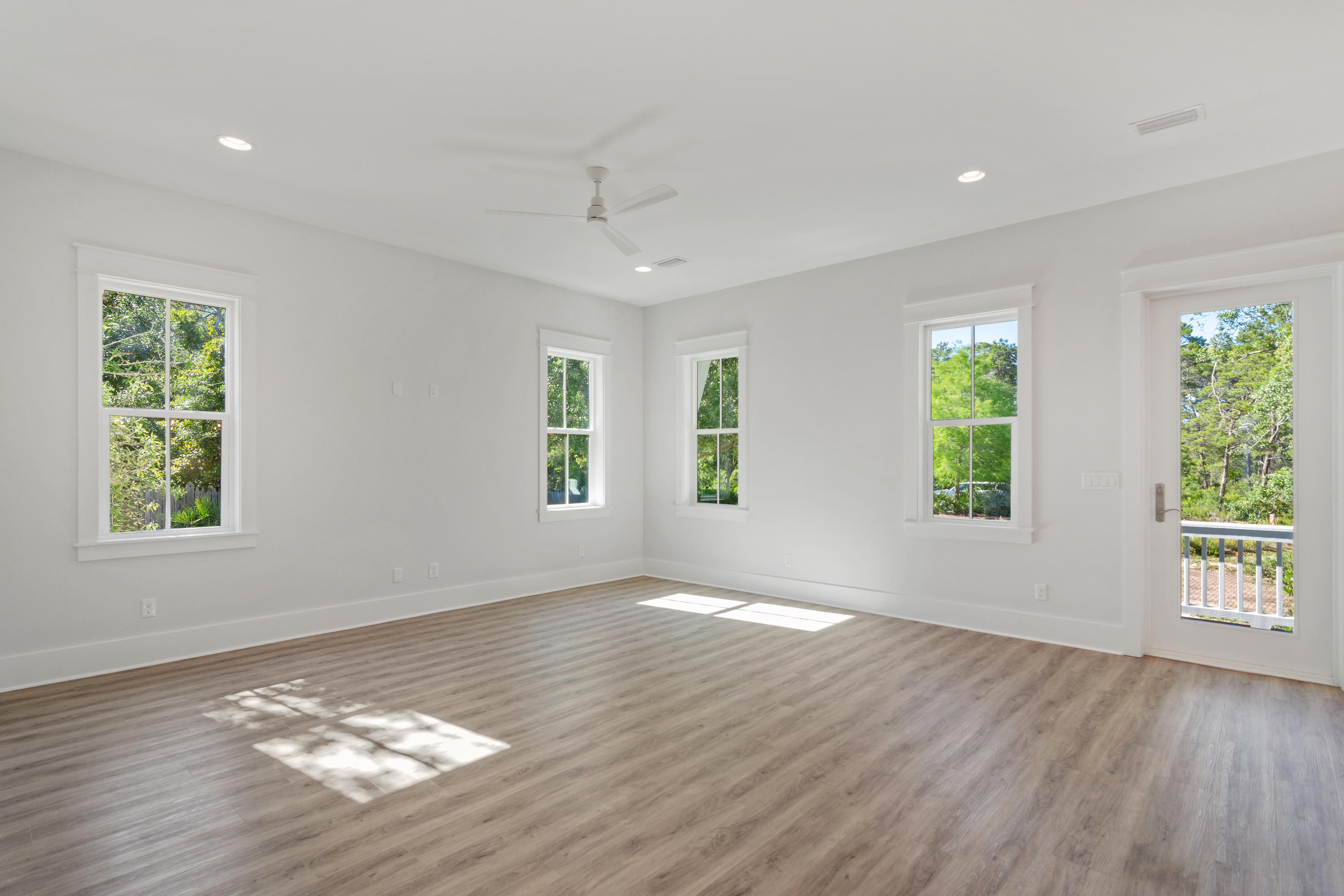 15 Lake Mist Ln Inlet Beach Inlet Beach, FL 32461 - Photo 10 of 48 a view of an empty room with wooden floor and a window