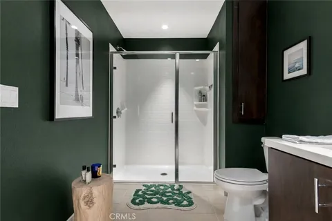 a bathroom with a toilet sink and shower