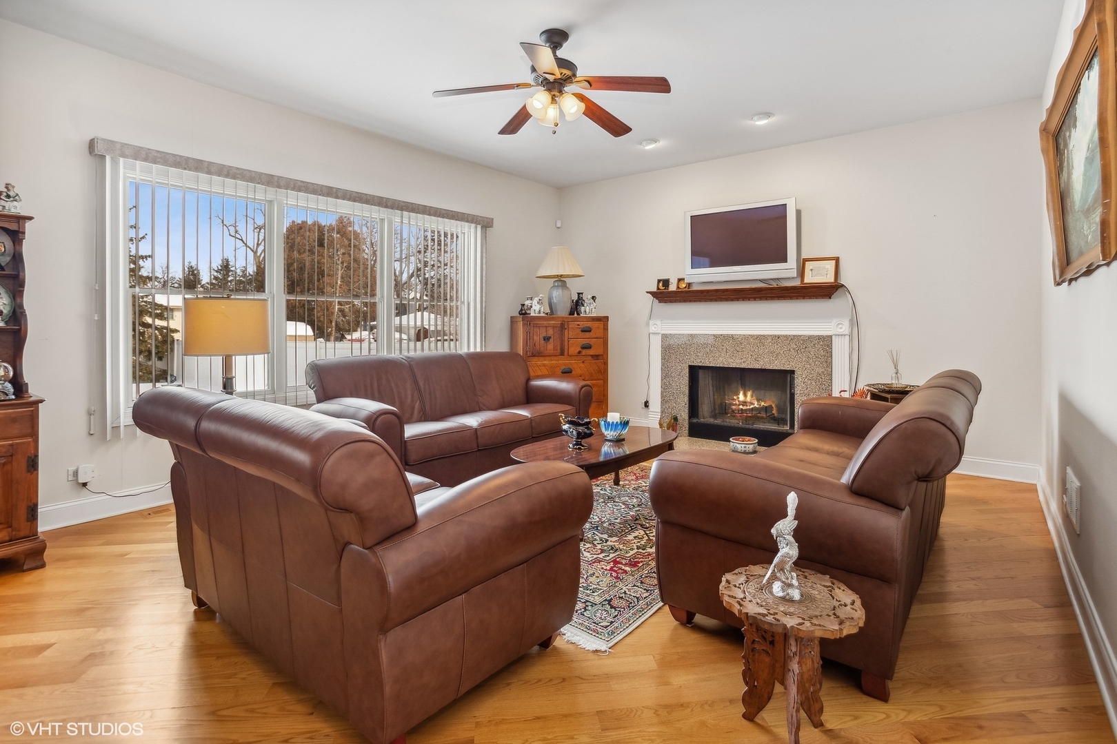 1034 East Woodrow Avenue Lombard, IL 60148 - Photo 12 of 36 a living room with furniture and a fireplace