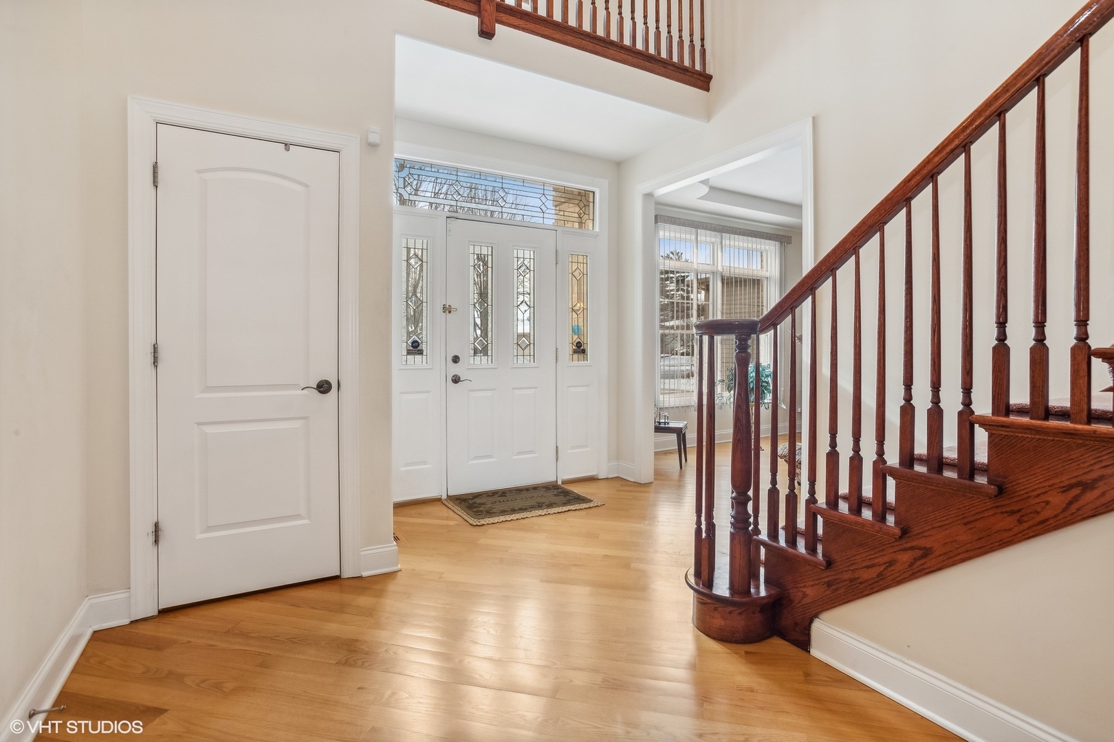 1034 East Woodrow Avenue Lombard, IL 60148 - Photo 2 of 36 a view of a hallway with wooden floor and staircase