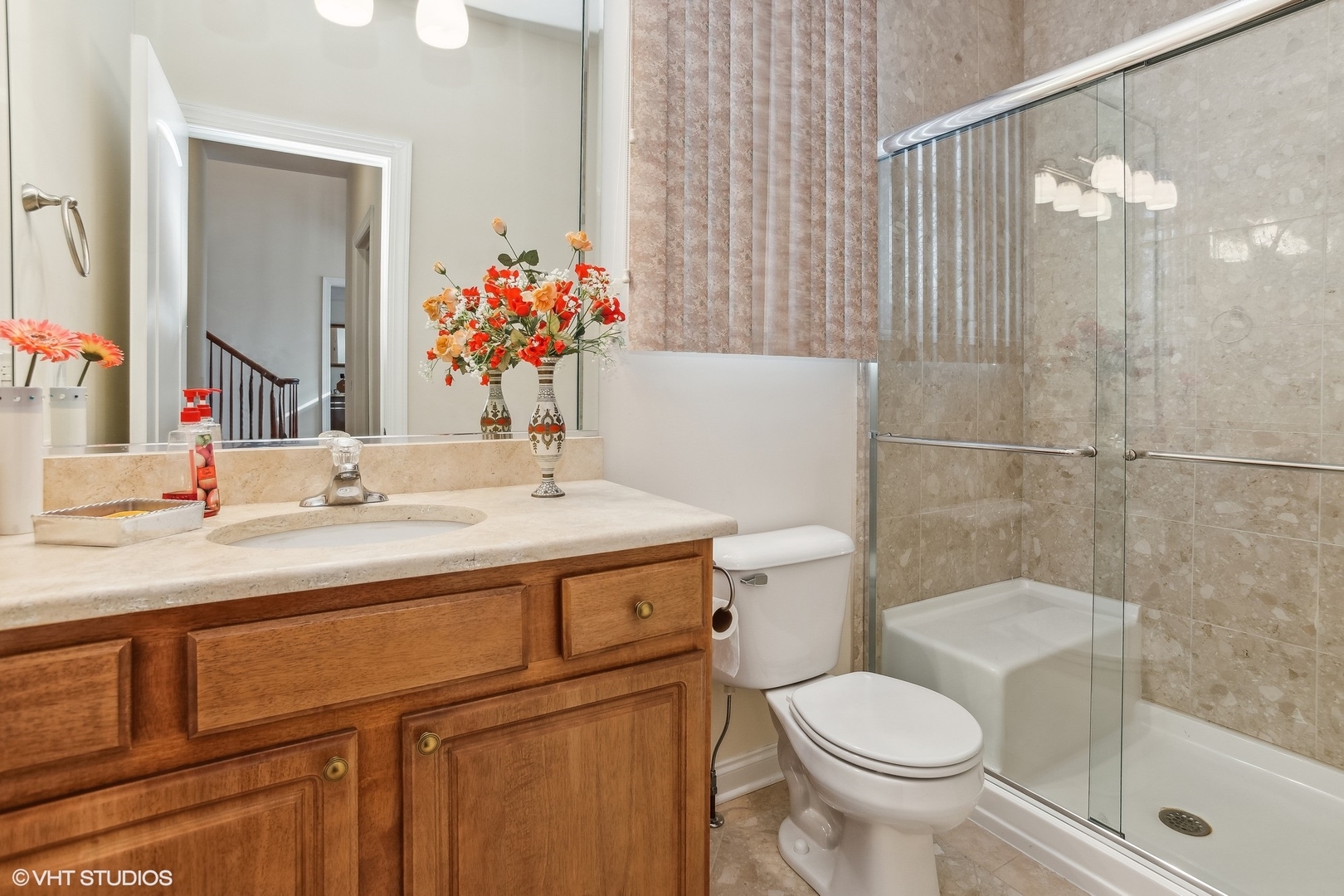 1034 East Woodrow Avenue Lombard, IL 60148 - Photo 24 of 36 a bathroom with a sink toilet and shower