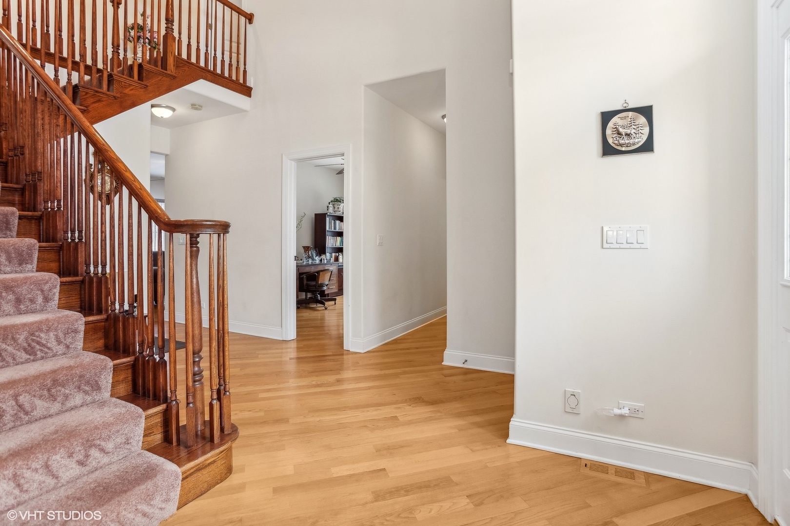 1034 East Woodrow Avenue Lombard, IL 60148 - Photo 3 of 36 a view of a hallway with wooden floor and entryway