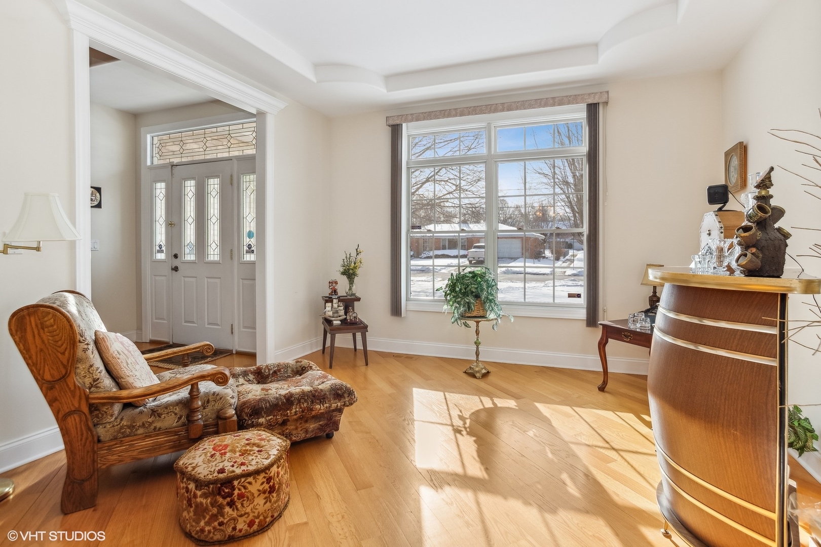 1034 East Woodrow Avenue Lombard, IL 60148 - Photo 5 of 36 a living room with furniture a dining table and a large window