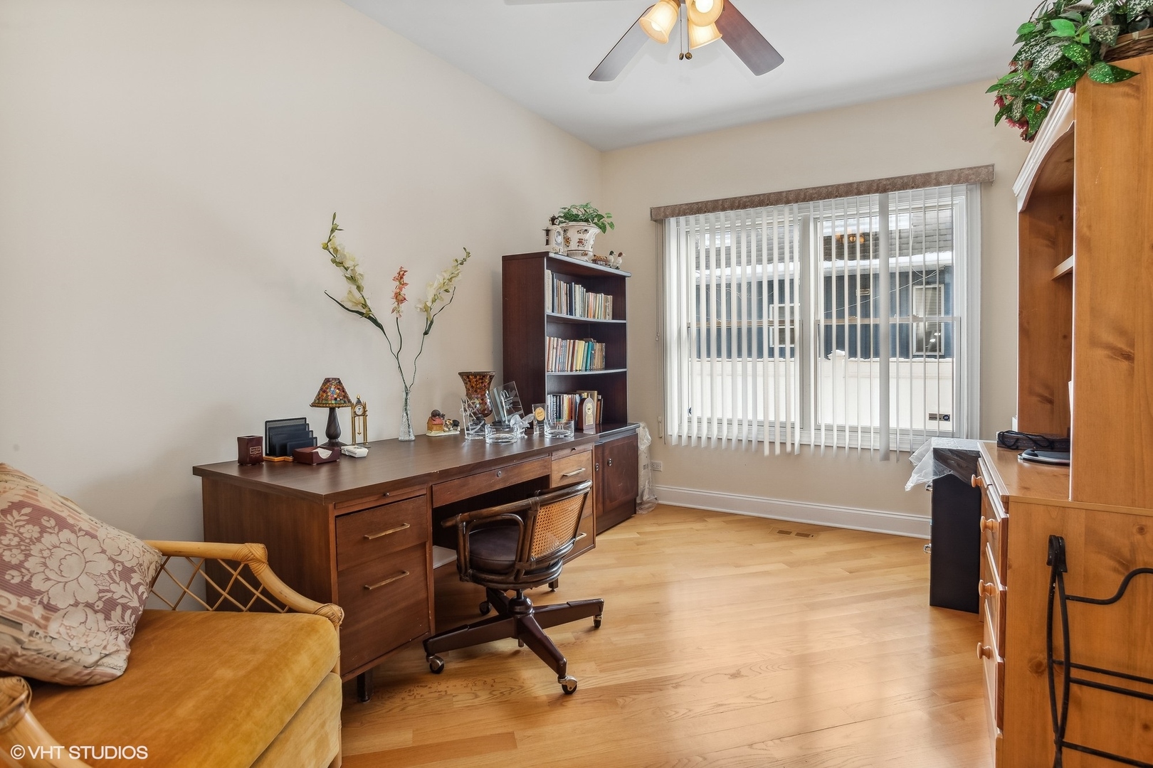 1034 East Woodrow Avenue Lombard, IL 60148 - Photo 7 of 36 a view of a workspace with furniture and a window