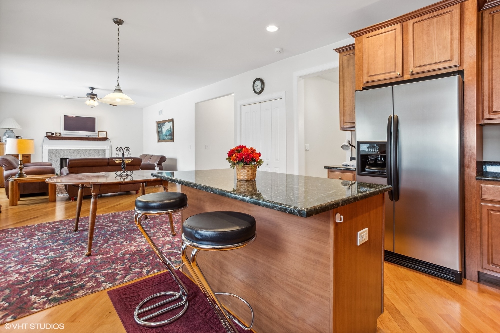 1034 East Woodrow Avenue Lombard, IL 60148 - Photo 10 of 36 a kitchen with stainless steel appliances granite countertop a sink stove and refrigerator