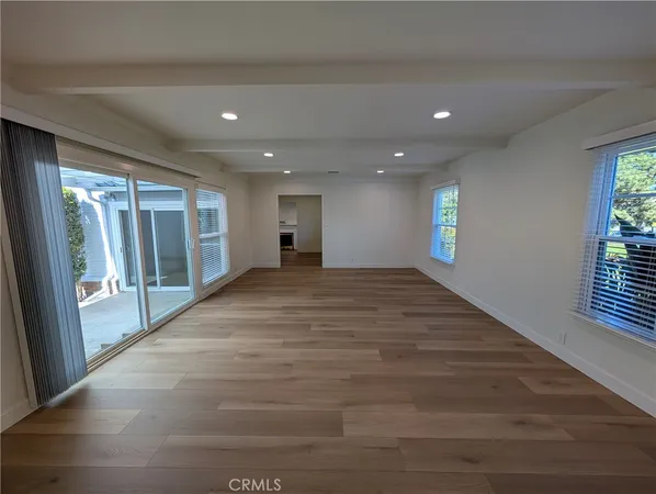 a view of hallway with wooden floor