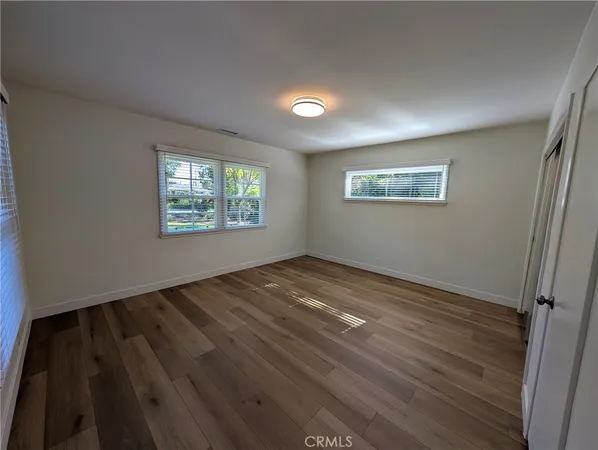 a room with cabinets and wooden floor
