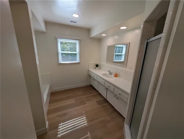 a view of wooden floor in an empty room