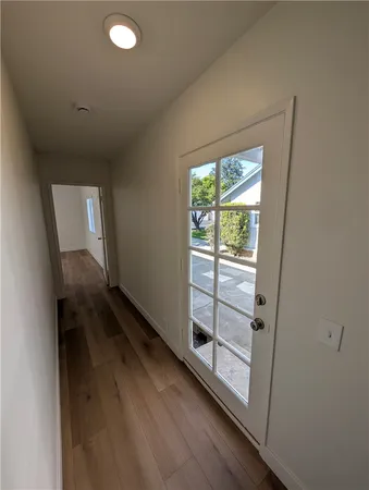 a view of empty room with a fireplace and window