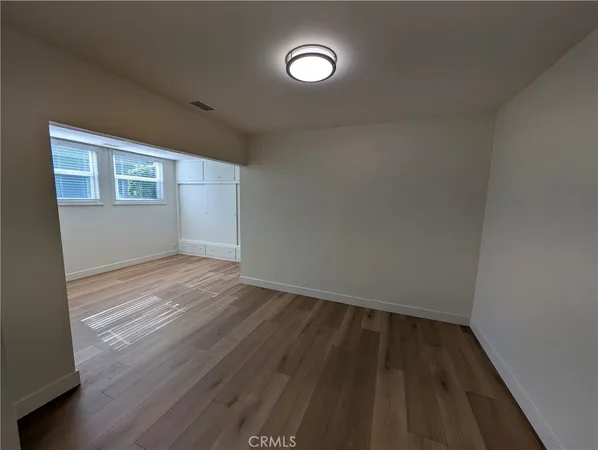 a kitchen with stainless steel appliances granite countertop a refrigerator a stove and a sink