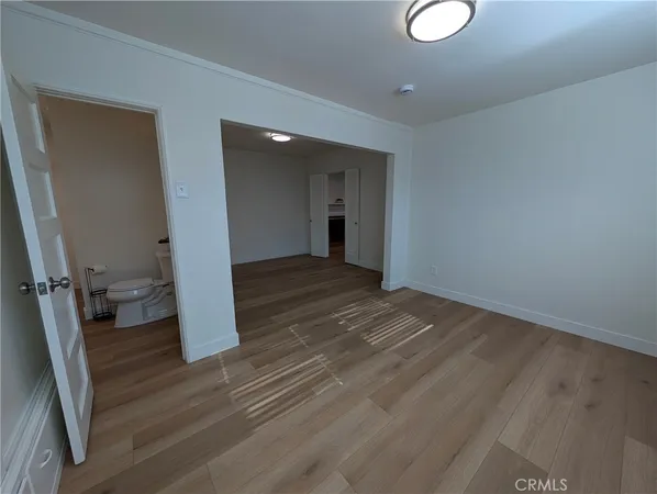 a big house with palm trees in front of it